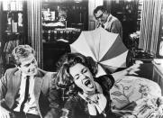 George Segal (from left), Elizabeth Taylor and Richard Burton (back) star in the marital black comedy "Who's Afraid of Virginia Woolf?"