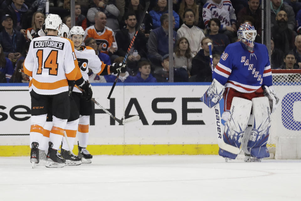 New York Rangers goaltender Henrik Lundqvist, right, reacts as the Philadelphia Flyers celebrates a goal by Travis Konecny, second from right, during the second period of the NHL hockey game, Sunday, March 1, 2020, in New York. (AP Photo/Seth Wenig)