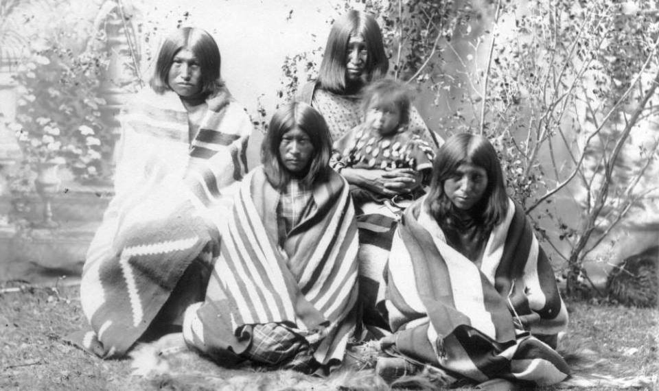 The wives and baby of Chief William Friday, an Arapaho chief who was well-known in the area of present-day Fort Collins in the mid-1800s.