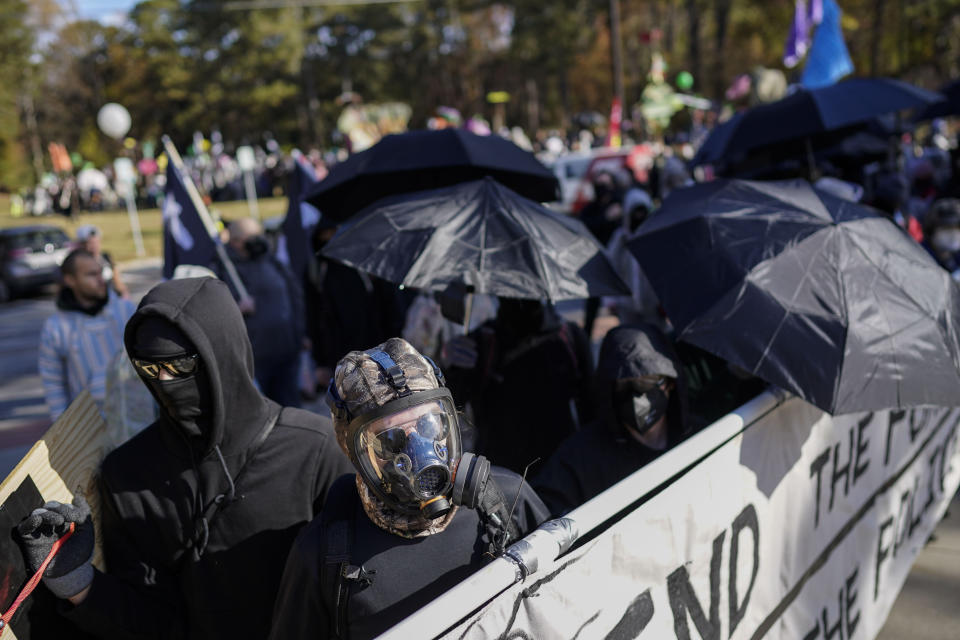 Protesters march during a demonstration in opposition to a new police training center, Monday, Nov. 13, 2023, in Atlanta. (AP Photo/Mike Stewart)