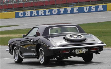 U.S. stock car racing driver Dale Earnhardt Jr. pulls out onto the track in Elvis Presley's 1973 Stutz Blackhawk III during a media event at Charlotte Motor Speedway (CMS) in Charlotte, North Carolina April 1, 2014, in this handout courtesy of CMS. REUTERS/CMS/HHP/Handout via Reuters