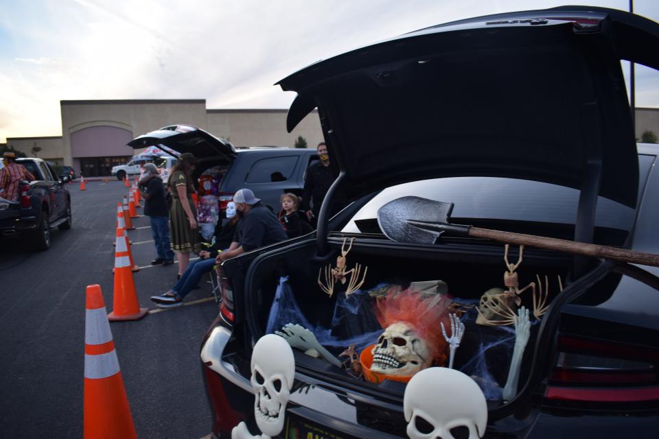 A car trunk is decked out with Halloween decorations as part of the LCPD drive-thru trick or treat event Saturday, Oct. 31, 2020, in the Mesilla Valley Mall parking lot.