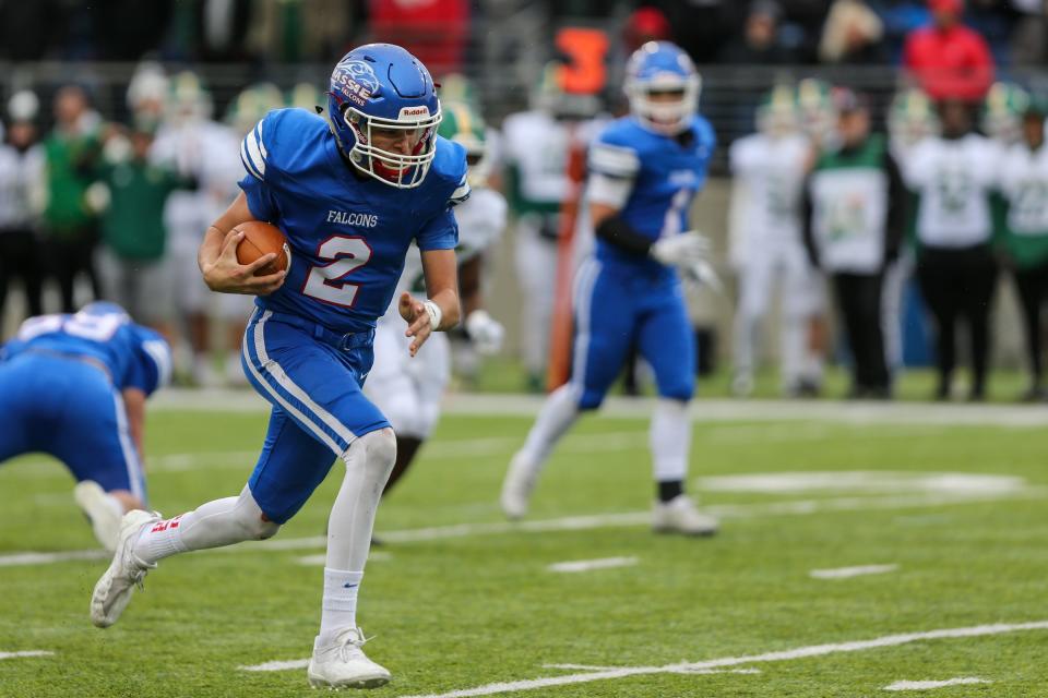 Falcons' Kody Zantene runs the ball down the field during the OHSAA Division IV State Final game between the Clinton-Massie Falcons and the Ursuline Fighting Irish at the Tom Benson Hall of Fame stadium on Friday Dec. 3, 2021. The Clinton-Massie Falcons won the game with a final score of 29-28.