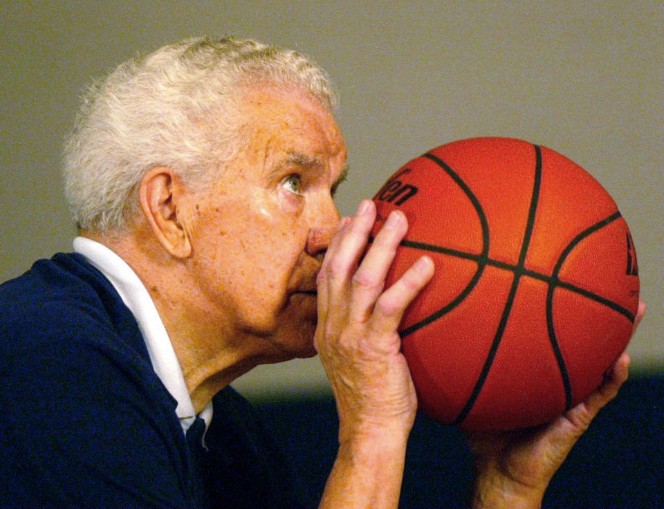 In this July 24, 2002, photo Dr. Tom Amberry shoots a free throw in Seal Beach, Calif. Amberry, a California podiatrist who made history in 1993 when he shot 2,750 consecutive free throws, has died. He was 94. Amberry died in Long Beach, Calif., on March 18, said his granddaughter, Roxanne Amberry. (Cindy Yamanaka/The Orange County Register via AP)