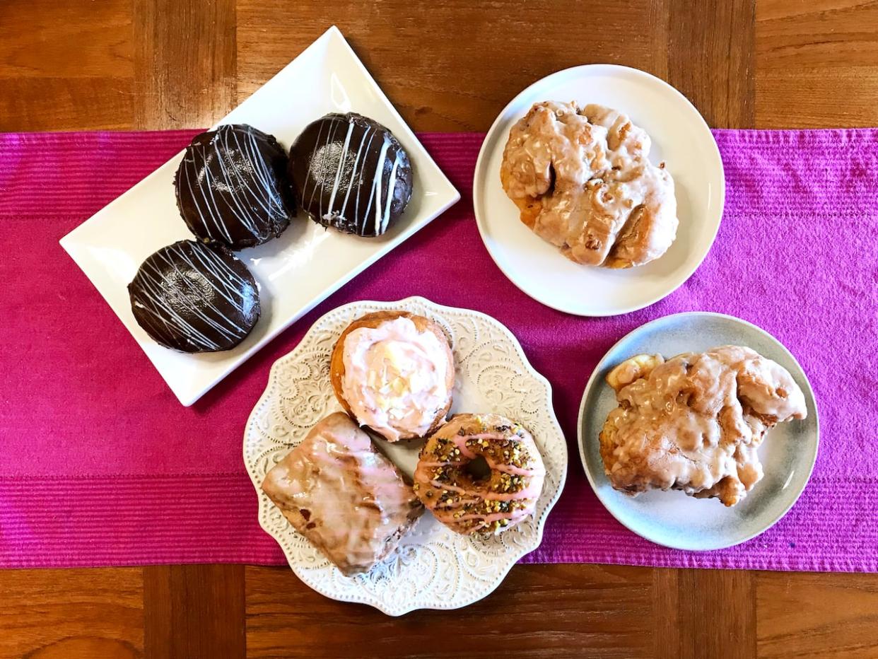 These doughnuts from Lady Glaze usually sell at $24 for 8, but through the Too Good To Go food app customers can get them for $7.99. (Jasmine Mangalaseril/CBC - image credit)