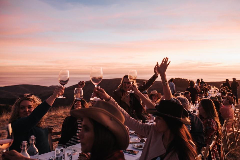 Diners offer a toast during an "Outstanding in the Field" dinner in Big Sur, CA.