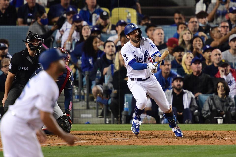 Chris Taylor follows through on the second of his three homers in Game 5 of the NLCS.