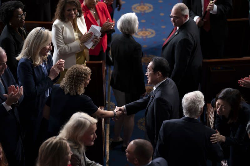 Japanese Prime Minister Fumio Kishida shakes hands with representatives before addresses a joint meeting of Congress in the House of Representatives on Thursday. Photo by Bonnie Cash/UPI