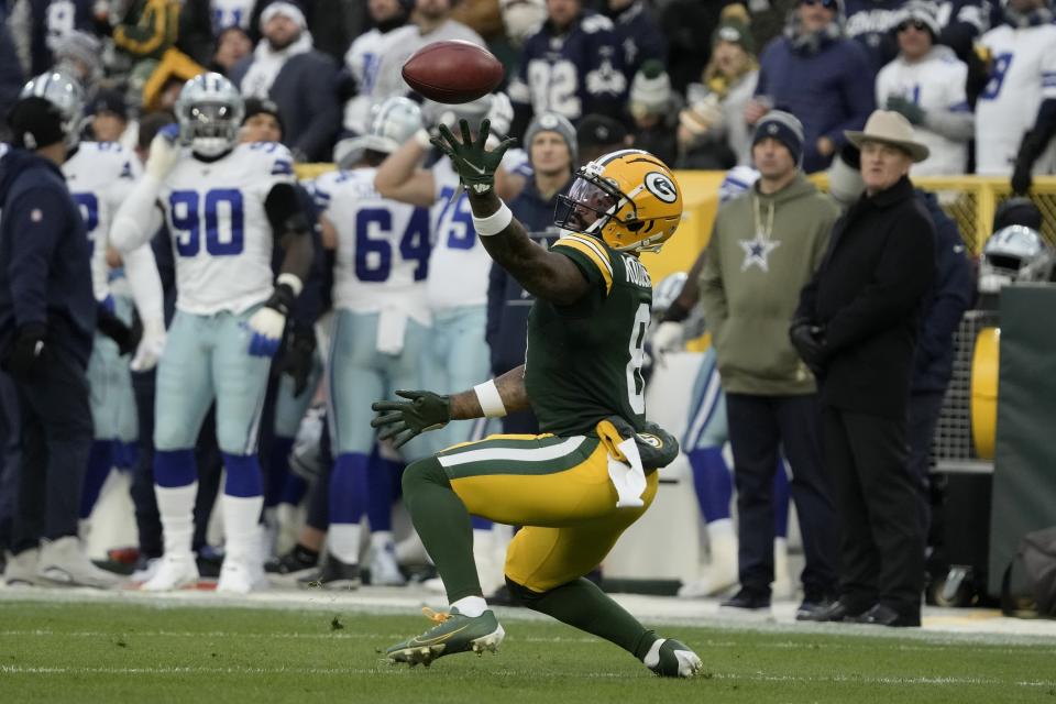 Green Bay Packers wide receiver Amari Rodgers bobbles a punt, but recovers and returns the ball for a short gain during the first half of an NFL football game against the Dallas Cowboys, Sunday, Nov. 13, 2022, in Green Bay, Wis. (AP Photo/Morry Gash)