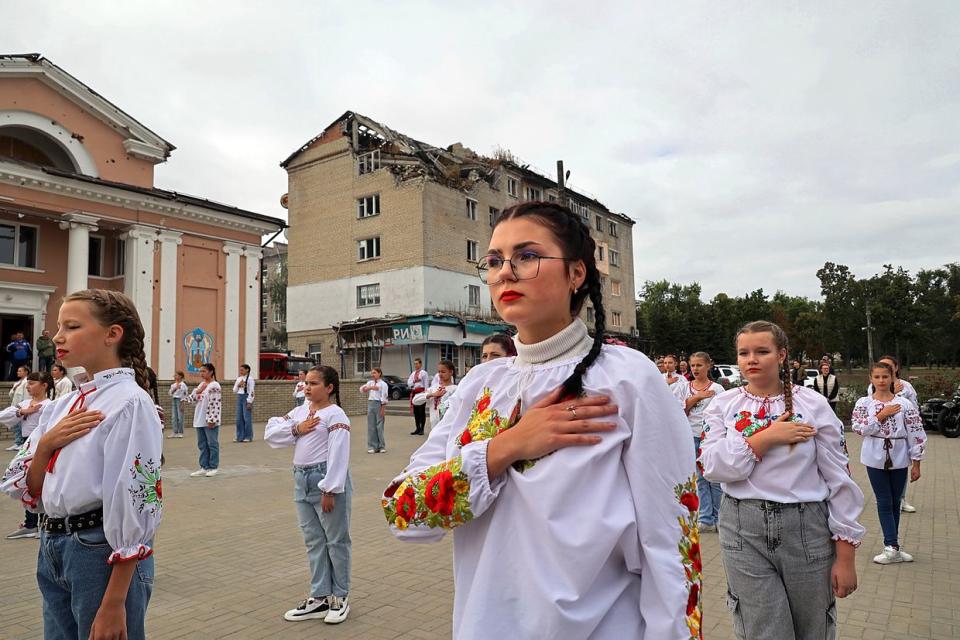 Students perform the national anthem during the celebration of the first anniversary of the liberation of Izium city from Russian invaders, Kharkiv Oblast, Sep.10, 2023. (Vyacheslav Madiyevskyy / Ukrinform/Future Publishing via Getty Images)