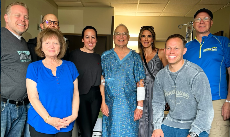 Richard Mayer surrounded by his family and the nurse that saved his life, Heather Lewis, at McLaren Northern Michigan after surviving a heart attack.