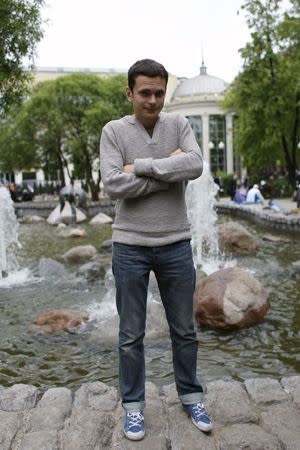 Russian opposition politician Ilya Yashin poses for a photograph at the site of a round-the-clock protest dubbed Occupy Abai, named after a monument to a Kazakh poet that is its focal point, in Moscow, Russia, May 14, 2012. REUTERS/Maxim Shemetov/Files