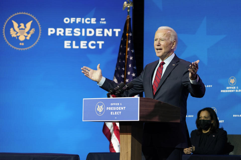 President-elect Joe Biden speaks during an event at The Queen theater in Wilmington, Del., Tuesday, Dec. 8, 2020, to announce his health care team. Vice President-elect Kamala Harris listens at right. (AP Photo/Susan Walsh)