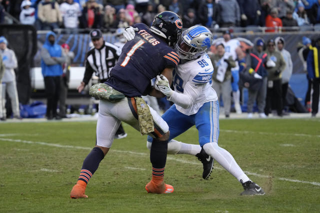 Chicago Bears quarterback Justin Fields (1) runs the ball against the  Detroit Lions during the first half of an NFL football game in Chicago,  Sunday, Nov. 13, 2022. (AP Photo/Nam Y. Huh)