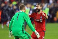 <p>Drew Moor #3 of Toronto FC celebrates with Clint Irwin #1 at the final whistle following the MLS Eastern Conference Final, Leg 2 game against Montreal Impact at BMO Field on November 30, 2016 in Toronto, Ontario, Canada. (Photo by Vaughn Ridley/Getty Images) </p>