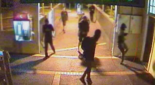 A youth kicks the office door of a station master before the gang brutally attacks him. Photo: 7News