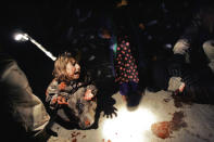 <p>Samar Hassan screams after her parents were killed by U.S. Soldiers with the 25th Infantry Division in a shooting January 18, 2005 in Tal Afar, Iraq. The troops fired on the Hassan family car when it unwittingly approached them during a dusk patrol in the tense northern Iraqi town. Parents Hussein and Camila Hassan were killed instantly, and a son Racan, 11, was seriously wounded in the abdomen. Racan, who lost the use of his legs, was treated later in the U.S. (Photo by Chris Hondros/Getty Images) </p>