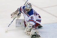 New York Rangers goaltender Igor Shesterkin (31) makes a save during the second period of an NHL hockey game against the New Jersey Devils, Tuesday, April 13, 2021, in Newark, N.J. (AP Photo/Kathy Willens)