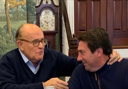 U.S. President Donald Trump's lead attorneys Jay Sekulow and Rudy Giuliani react after Attorney General William Barr sent lawmakers a summary of the key findings in Special Counsel Robert Mueller's Russia investigation, at an office in Washington, U.S., March 24, 2019. Picture taken March 24, 2019. Courtesy of Peter Halmagyi/Handout via REUTERS