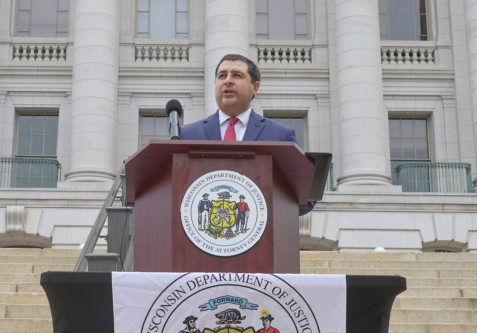 Wisconsin Attorney General Josh Kaul holds a news conference outside the Wisconsin State Capitol building in Madison, Wis. Tuesday, June 4, 2024. Kaul filed felony forgery charges Tuesday against two attorneys and an aide who helped submit paperwork falsely saying that former President Donald Trump had won the battleground state in 2020. (John Hart/Wisconsin State Journal via AP)