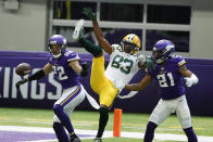 Minnesota Vikings free safety Harrison Smith (22) and cornerback Mike Hughes (21) break up a pass intended for Green Bay Packers wide receiver Marquez Valdes-Scantling (83) during the first half of an NFL football game, Sunday, Sept. 13, 2020, in Minneapolis. (AP Photo/Bruce Kluckhohn)