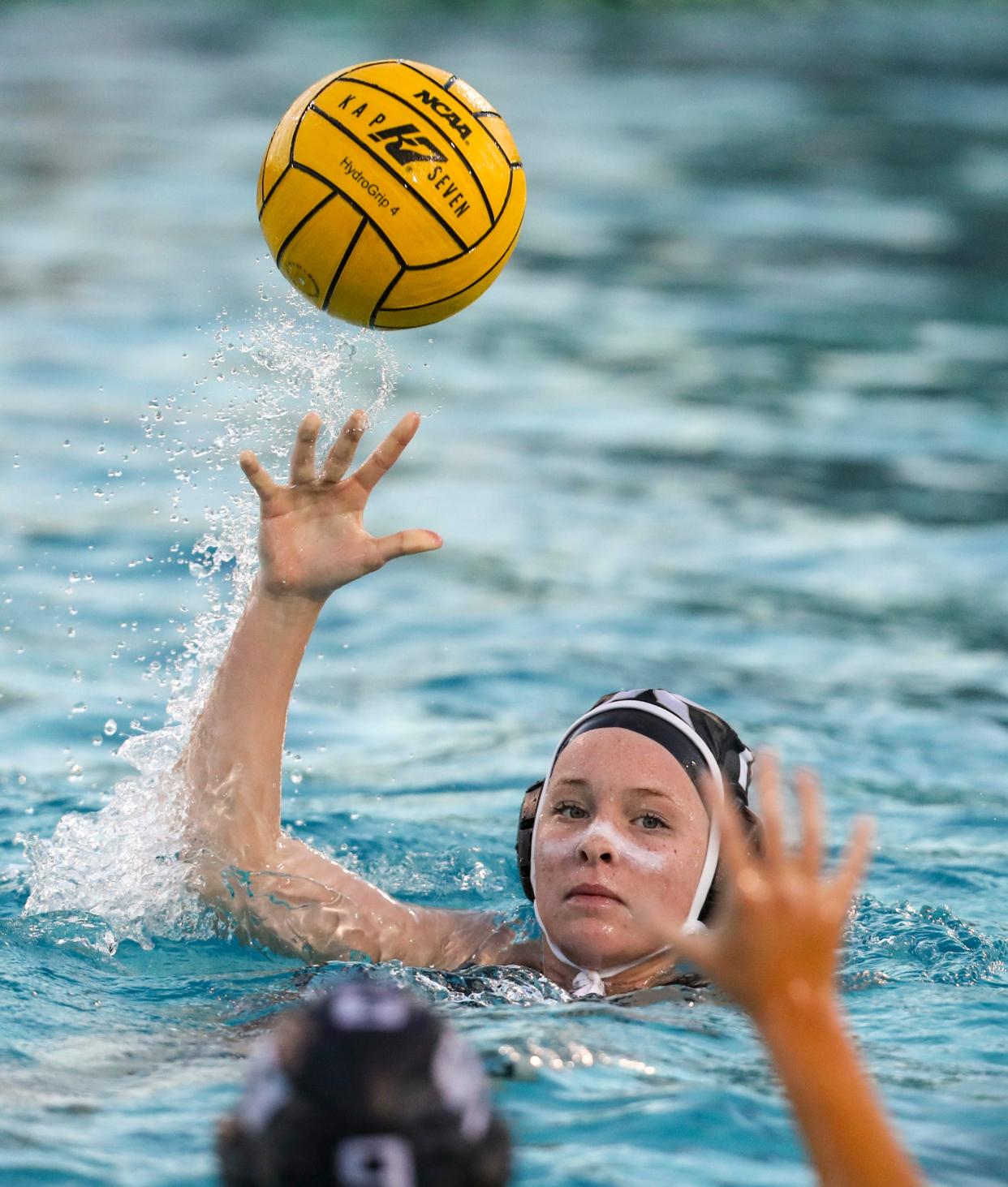 Xavier Prep's Niamh Cooper (10) passes the ball during the first quarter of their game at the Palm Desert Aquatic Center in Palm Desert, Calif., Tuesday, Feb. 7, 2023. 