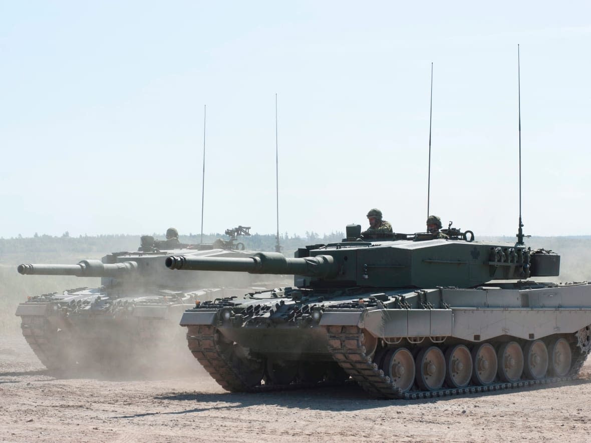  A Canadian Forces Leopard 2A4 tank displays its firepower on the firing range at CFB Gagetown in Oromocto, N.B., in 2012. (David Smith/The Canadian Press - image credit)