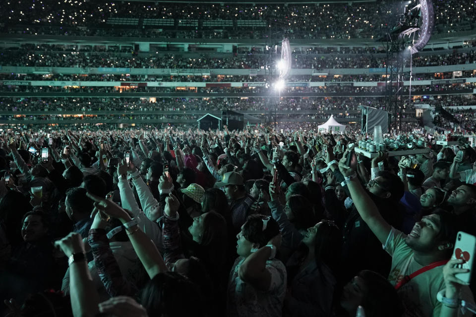 People listen to Bad Bunny perform at Azteca Stadium in Mexico City, Friday, Dec. 9, 2022. (AP Photo/Eduardo Verdugo)