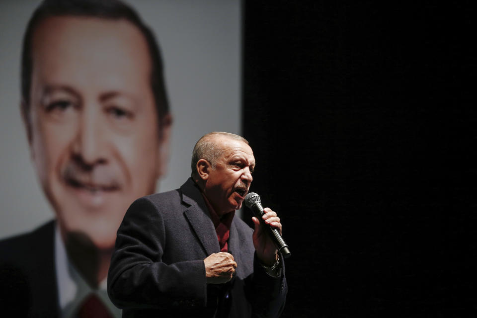 Turkey's President Recep Tayyip Erdogan addresses the supporters of his ruling Justice and Development Party, AKP, at a rally in Istanbul, late Tuesday, March 19, 2019, ahead of local elections scheduled for March 31, 2019. (AP Photo/Emrah Gurel)