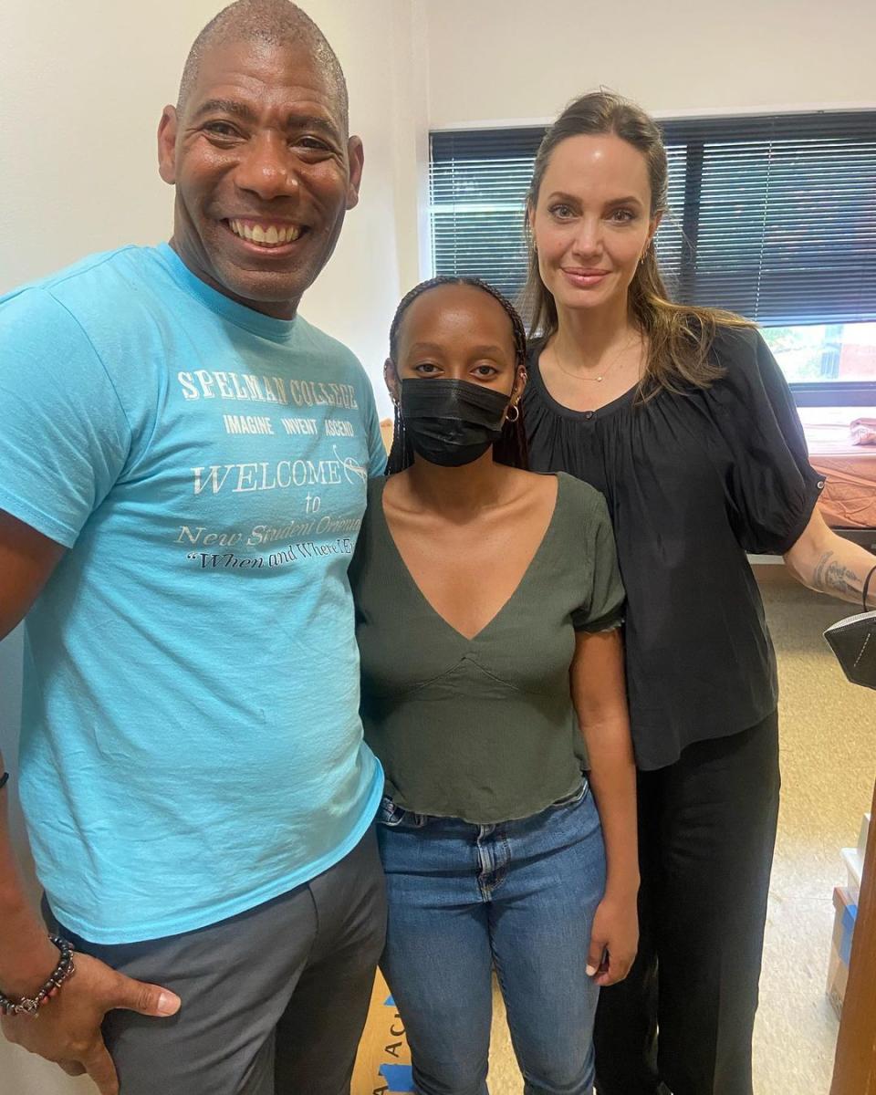 Dr. Daryl Holloman, vice president for student affairs at Spelman College, posed with Angelina Jolie and Zahara Jolie-Pitt, who will graduate with the class of 2026.  (Courtesy Dr. Darryl Holloman)