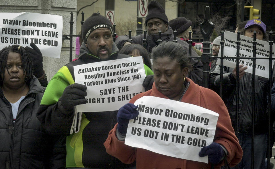 File- This photo from Monday, Feb. 24, 2003, shows advocates for the homeless protesting New York City's plan to seek legal authority to eject some people from shelters over conduct and compliance issues, during a protest rally at City Hall. By 2013, most renter households were spending 30% or more of their income on housing and the number of people in homeless shelters rose about 60% during Mayor Michael Bloomberg's tenure. (AP Photo/Ed Bailey, File)