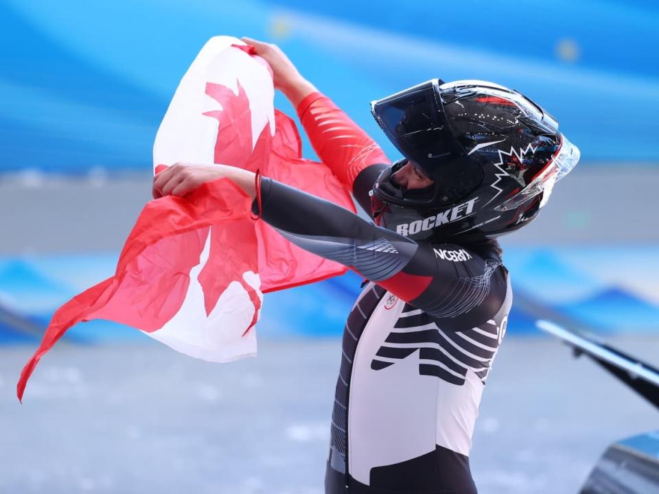 Canada's Christine de Bruin celebrates after racing to bronze in the Olympic debut of monobob on Monday in Beijing. (Julian Finney/Getty Images - image credit)