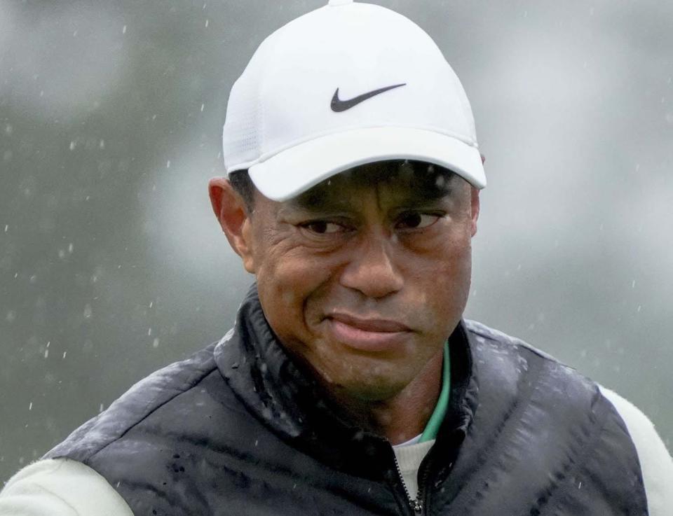 Tiger Woods made the cut but enters play Sunday in last place.