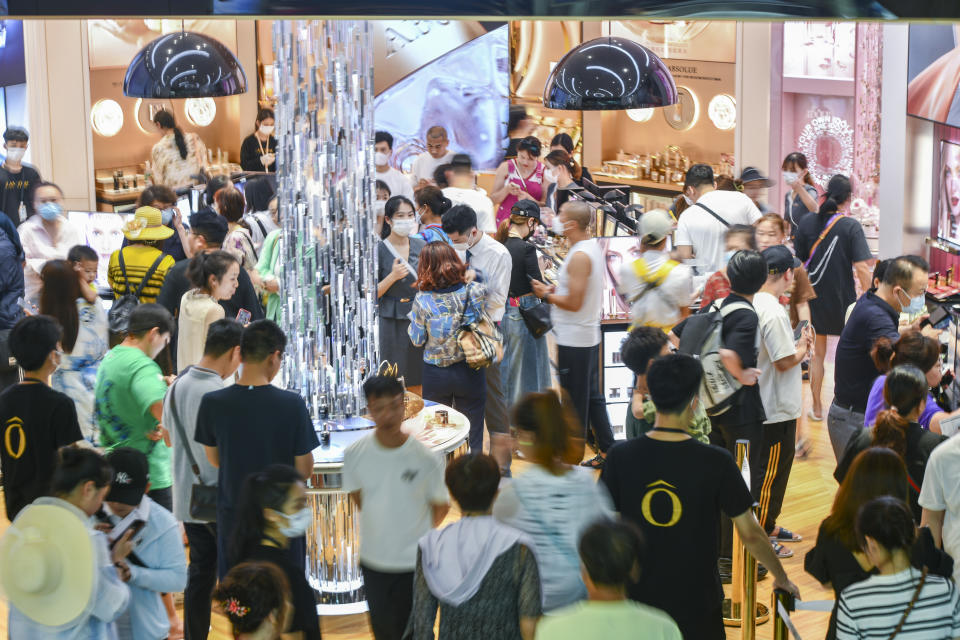SANYA, CHINA - MARCH 22: Customers go shopping at CDF Sanya International Duty Free Mall on March 22, 203 in Sanya, Hainan Province of China. Hainan province will add two methods, namely "guaranteed pick-up" and "buy and pick-up",  for picking up offshore duty-free goods starting on April 1. (Photo by Luo Yunfei/China News Service/VCG via Getty Images)