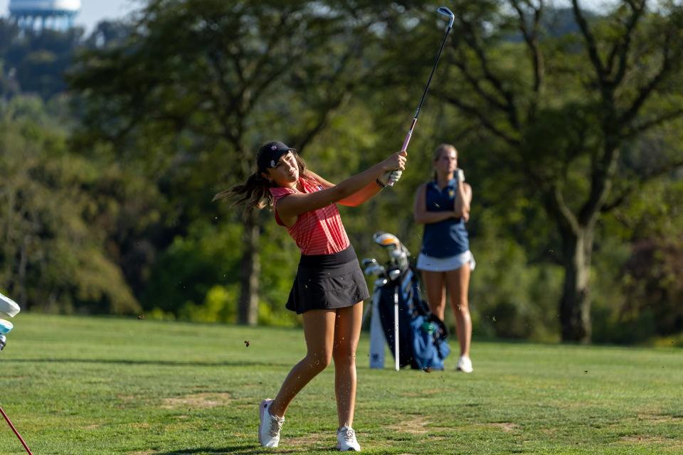 Moon Area's Liv DeGori watches her ball's flight during the Tigers section match against Mt. Lebanon at Mount Lebanon Golf Course on Sept. 10.