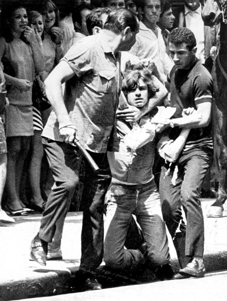 Unidentified men detain a student during a protest in Sao Paulo, Brazil, on 9 October 1968.