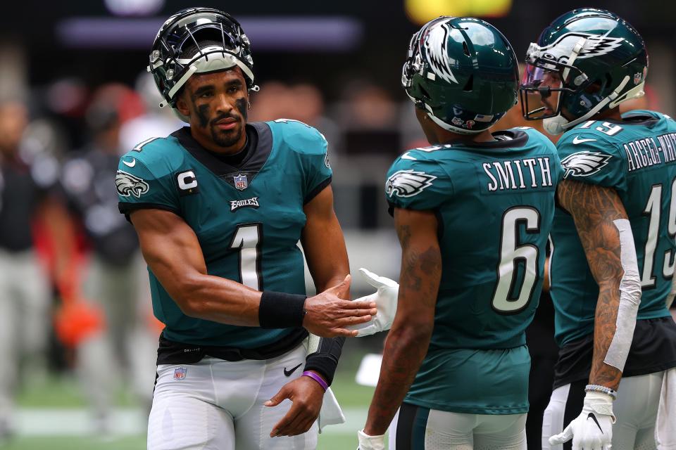 Quarterback Jalen Hurts, left, and wide receiver  DeVonta Smith showed some instant chemistry in the Eagles' opener.