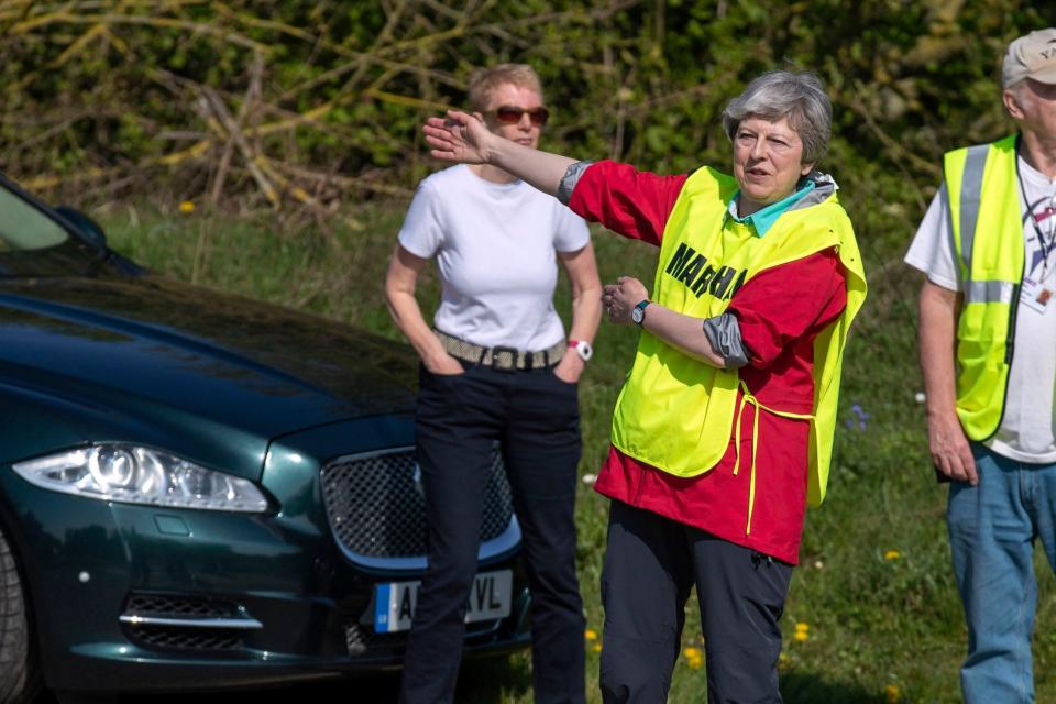 Mrs May directed runners in Maidenhead's Easter 10 (PA)