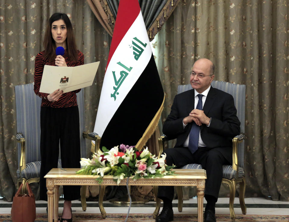 Nobel Peace Prize laureate Nadia Murad, left, speaks during a meeting with her country's President Barham Salih, in Baghdad, Iraq, Wednesday, Dec. 12, 2018. Murad received the Nobel Peace Prize in 2018 for her advocacy on behalf of victims of wartime sexual violence. Murad, a member of Iraq's Yazidi minority, was among thousands of women and girls who were captured and forced into sexual slavery by Islamic State militants in 2014. (AP Photo/Karim Kadim)