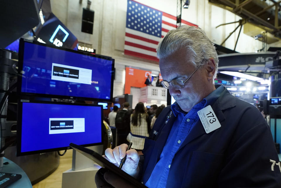 Trader Frank O'Connell works on the floor of the New York Stock Exchange, Wednesday, Sept. 22, 2021. Stocks rose broadly on Wall Street Wednesday ahead of an update from the Federal Reserve on how and when it might begin easing its extraordinary support measures for the economy. (AP Photo/Richard Drew)