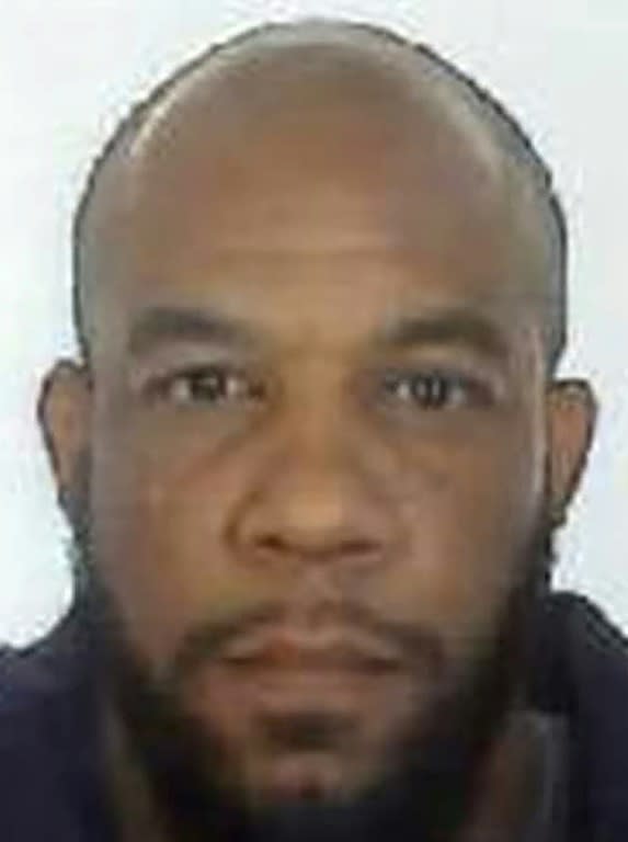 Khalid Masood, seen here in a passport-style photo released by police, used multiple aliases including the names Adrian Elms and Adrian Russell Ajao