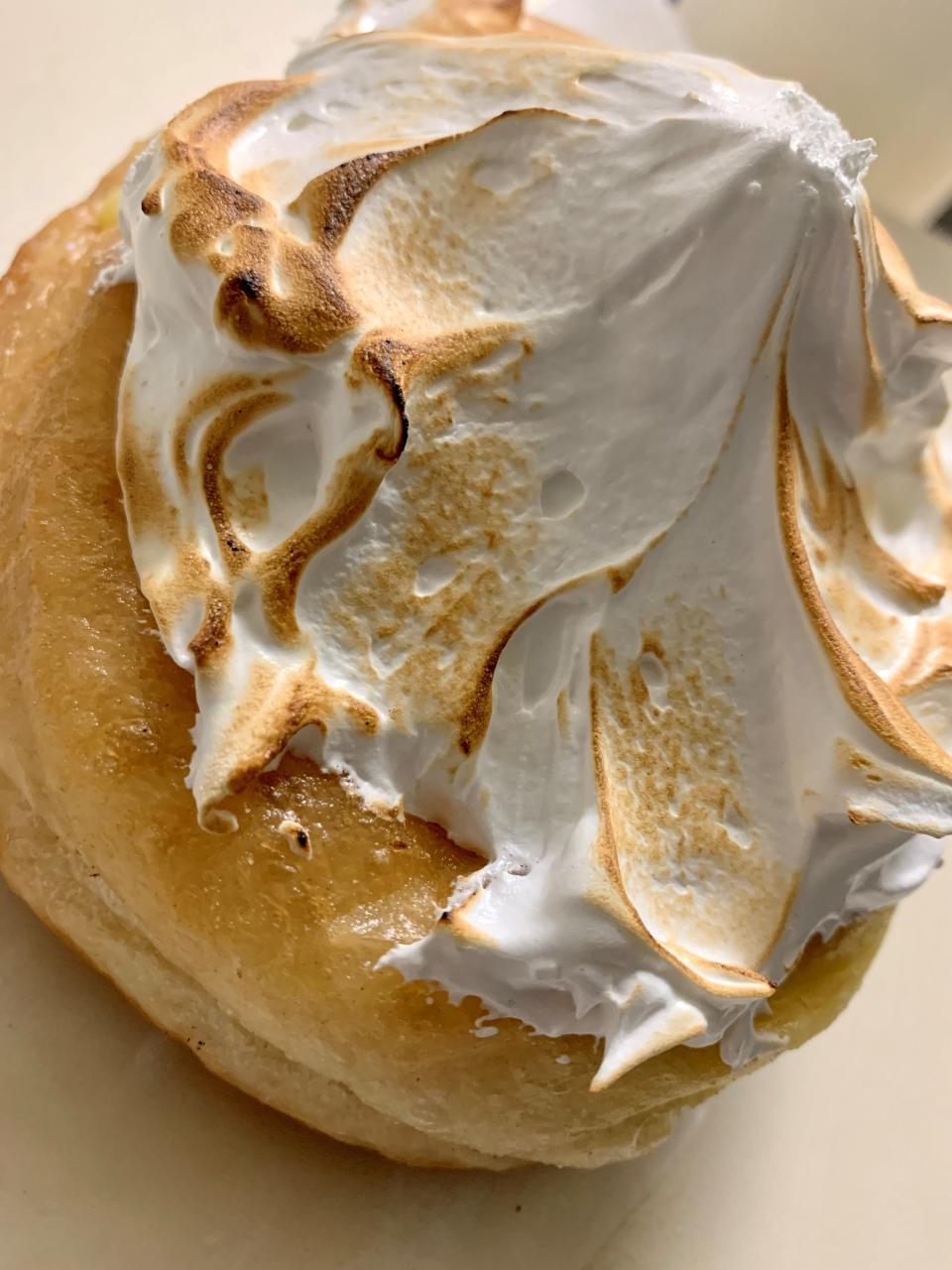 The lemon merengue doughnut at Cypress Table in Cocoa Village is a combination of soft, unsweetened doughnut topped by lemon custard and a twisting, pointy mountain of torched, soft meringue.