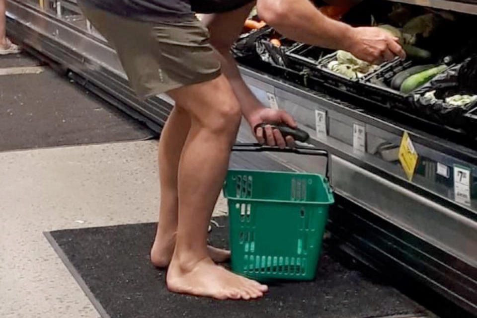 Barefoot Woolworths shopper