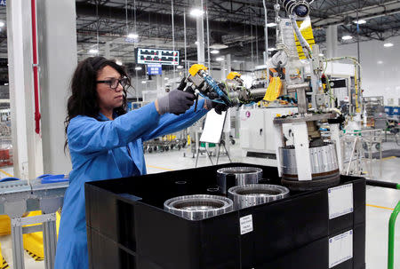 General Motors production worker Dina Mays works on the 10-speed transmission assembly at the General Motors (GM) Powertrain Transmission plant in Toledo, Ohio, U.S. March 6, 2019. REUTERS/Rebecca Cook/Files