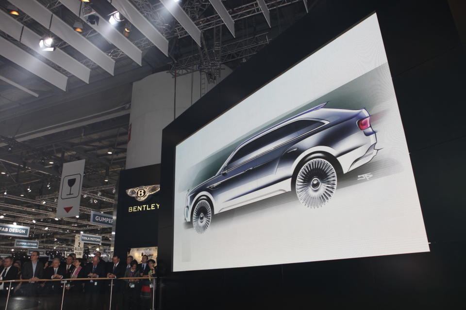 After months of rumors, Bentley revealed today a concept for its first sport utility vehicle ever: the 600-hp Bentley EXP 9 F. When it comes to vehicles for the wealthiest people in the world, restraint is so last century. With ultra-luxury vehicle sales rising on strong demand from China and the Middle East, the SUV would make the most financial sense as an addition. Given that the Continental starts around $190,000 and the Mulsanne around $280,000, it's easy to imagine a Bentley SUV with a sticker of about $250,000. Powered by a twin-turbo W-12 capable of 600 hp and 590 ft-lbs. of torque, Bentley says the EXP 9 would rank among the fastest vehicles of its kind. All that motive force gets to the ground through an 8-speed transmission and all-wheel-drive system turning 23-inch chrome wheels that are as bling-y as anything from Tire Rack. Inside lies the usual assortment of hand-stitched leathers, wood veneers and one-percentery touches like a split tailgate that folds down to reveal a custom dining set.