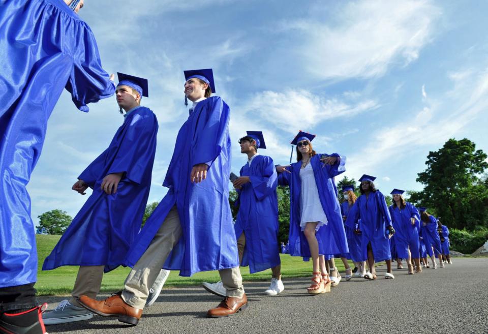 Graduates march in during the Blue Hills Regional Technical High School commencement ceremony in Canton, Tuesday, June 7, 2022.