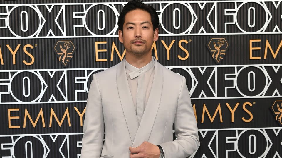 “Beef” actor Joseph Lee wore an all beige-grey suit with a playful mandarin collared shirt. - Richard Shotwell/Invision/AP