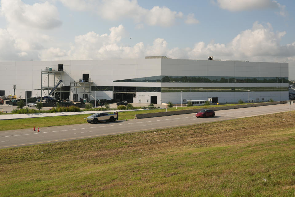 Tesla's Gigafactory is seen, Thursday, June 13, 2024, in Austin, Texas. Tesla shareholders are charting the future of the electric vehicle company as they wrap up voting whether or not to restore CEO Elon Musk's massive pay package that was thrown out by a Delaware judge. (AP Photo/Eric Gay)