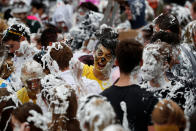 <p>Students from St Andrews University are covered in foam as they conclude the traditional “Raisin Weekend” on Lower College Lawn, at St Andrews, Scotland, Oct. 23, 2017. (Photo: Russell Cheyne/Reuters) </p>