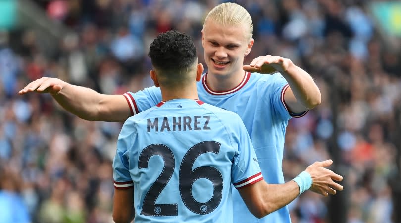   Riyad Mahrez celebrates his second goal against Sheffield United with Manchester City team-mate Erling Haaland at Wembley in April 2023. 